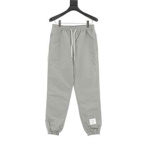 Pantaloni sportivi della linea TB in tessuto nylon